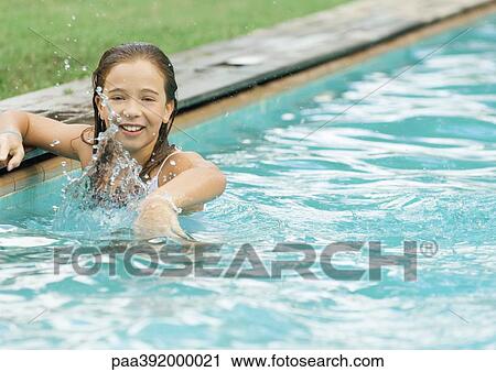 Little girl in swimming pool, splashing View Large Photo Image Stock Image - Little girl in swimming pool, splashing. Fotosearch