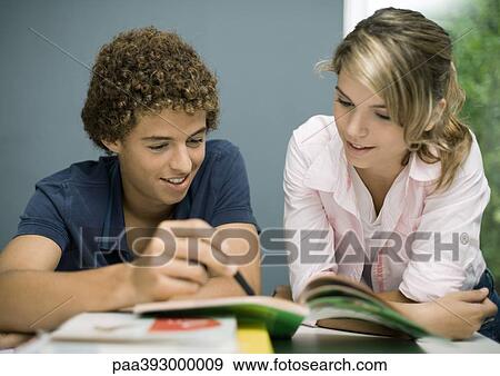 Adolescent boy and female friend doing homework View Large Photo Image Stock Photo - Adolescent boy and female friend doing homework. Fotosearch