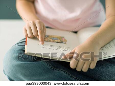 Child reading book, pointing to words, close-up View Large Photo Image Stock Image - Child reading book, pointing to words, close-up. Fotosearch