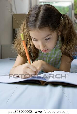 Girl doing homework View Large Photo Image Stock Photo - Girl doing homework. Fotosearch