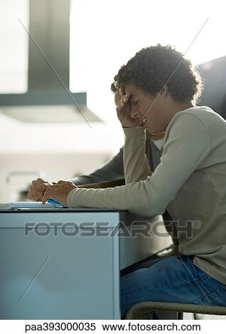 Man helping teenage son with homework, boy covering face View Large Photo Image Stock Photography - Man helping teenage son with homework, boy covering face. Fotosearch