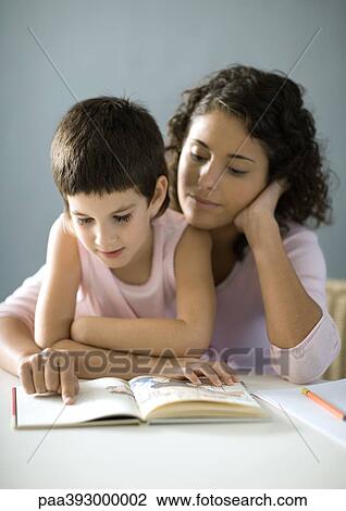 Stock Image - Mother and child reading book. Fotosearch