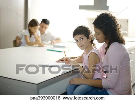 Parents helping children with homework View Large Photo Image Stock Photograph - Parents helping children with homework. Fotosearch