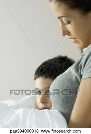 Child leaning against mother View Large Photo Image Stock Photo - Child leaning against mother. Fotosearch