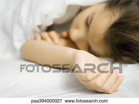 Child lying in bed View Large Photo Image Stock Photo - Child lying in bed. Fotosearch