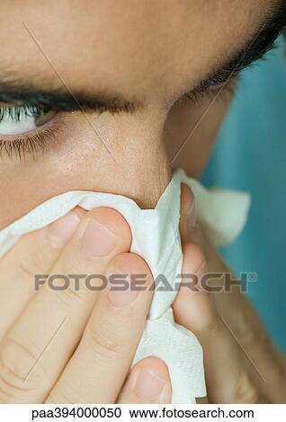 Stock Image - Man blowing nose. Fotosearch