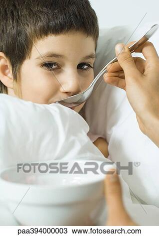 Mother's hands feeding child soup View Large Photo Image Stock Image - Mother's hands feeding child soup. Fotosearch