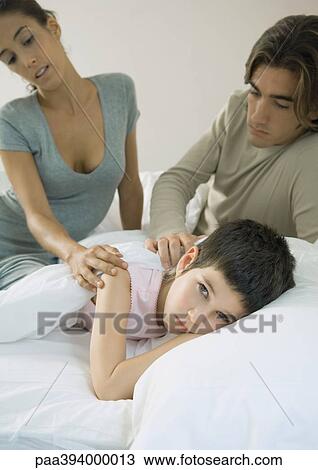 Stock Image - Parents with sick child. Fotosearch