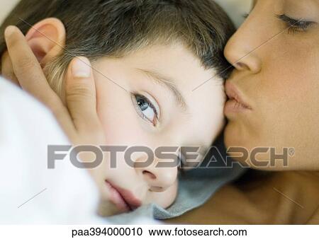 Woman kissing child View Large Photo Image Stock Image - Woman kissing child. Fotosearch