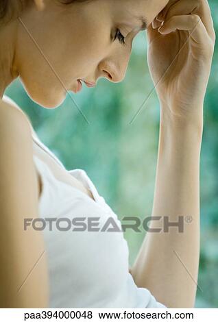 Woman looking down View Large Photo Image Stock Photo - Woman looking down. Fotosearch