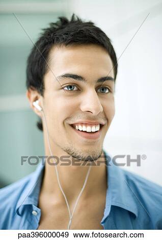 Teen boy listening to earphones View Large Photo Image Stock Photo - Teen boy listening to earphones. Fotosearch