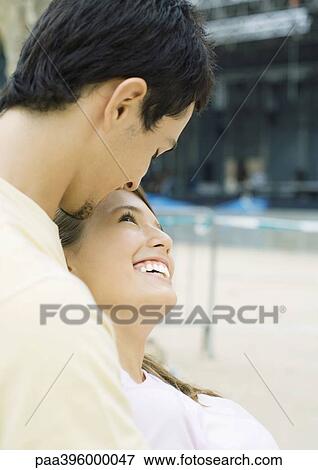 Stock Photo - Teen couple embracing. Fotosearch
