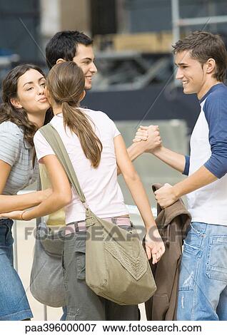 Stock Photo - Teens greeting each other. Fotosearch