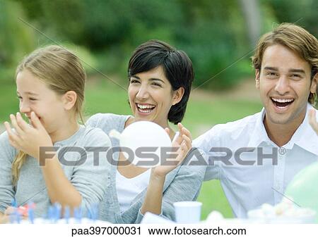 Family having outdoor birthday party View Large Photo Image Stock Image - Family having outdoor birthday party. Fotosearch