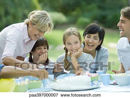 Family having outdoor birthday party View Large Photo Image Stock Photo - Family having outdoor birthday party. Fotosearch