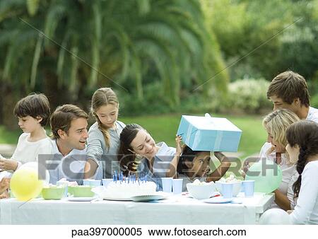 Stock Photography - Family having outdoor birthday party. Fotosearch