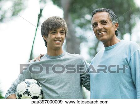 Stock Photo - Mature man with teenage grandson. Fotosearch