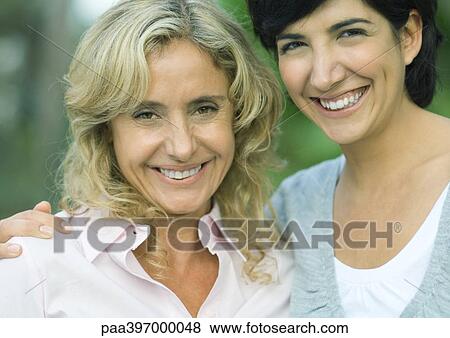 Mature woman and adult daughter, smiling at camera View Large Photo Image Stock Photo - Mature woman and adult daughter, smiling at camera. Fotosearch