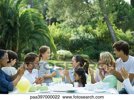 Stock Image - Outdoor birthday party. Fotosearch