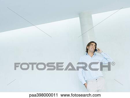 Man using cell phone View Large Photo Image Stock Image - Man using cell phone. Fotosearch