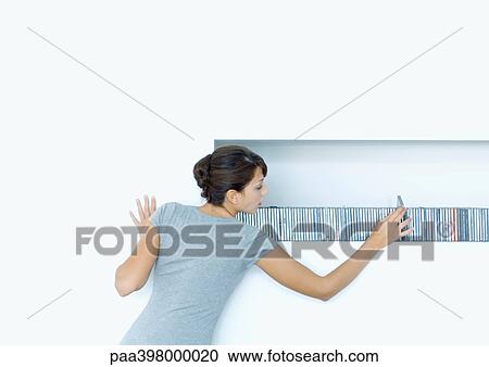Woman taking CD from shelf View Large Photo Image Stock Image - Woman taking CD from shelf. Fotosearch