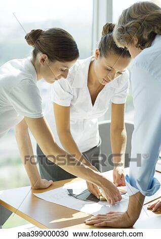 Two female and one male professional looking at color swatches View Large Photo Image Stock Image - Two female and one male professional looking at color swatches. Fotosearch