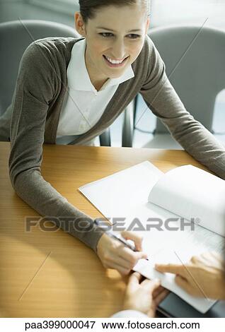Stock Photo - Woman signing contract. Fotosearch