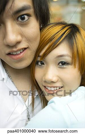 Stock Image - Teenage couple, portrait. Fotosearch