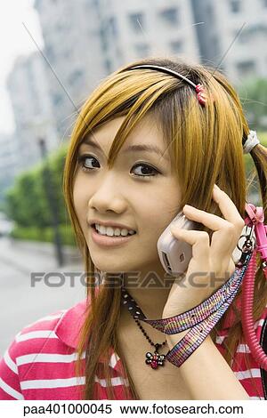 Teenage girl using cell phone View Large Photo Image Stock Photography - Teenage girl using cell phone. Fotosearch