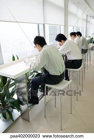 Business executives eating in cafeteria View Large Photo Image Stock Image - Business executives eating in cafeteria. Fotosearch