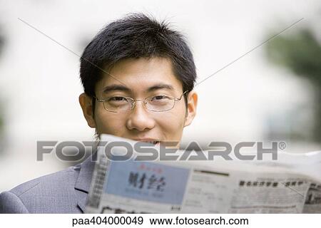 Businessman reading newspaper View Large Photo Image Stock Photo - Businessman reading newspaper. Fotosearch