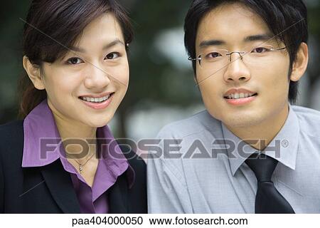 Young businessman and businesswoman, close-up, portrait View Large Photo Image Stock Image - Young businessman and businesswoman, close-up, portrait. Fotosearch