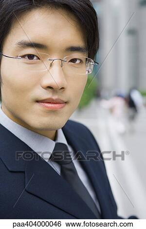 Young businessman, portrait, close-up View Large Photo Image Stock Photograph - Young businessman, portrait, close-up. Fotosearch