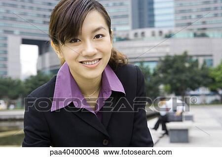 Young businesswoman in office park, portrait View Large Photo Image Stock Photo - Young businesswoman in office park, portrait. Fotosearch