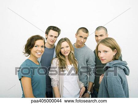 Picture - Group of young adults standing, smiling at camera. Fotosearch