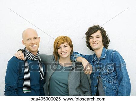 Stock Photography - Three young adult friends, portrait. Fotosearch