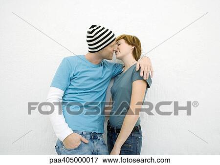 Stock Photo - Young couple kissing. Fotosearch