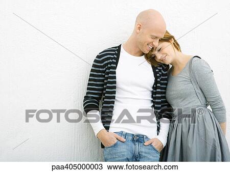 Young couple, woman leaning head on man's shoulder View Large Photo Image Stock Image - Young couple, woman leaning head on man's shoulder. Fotosearch