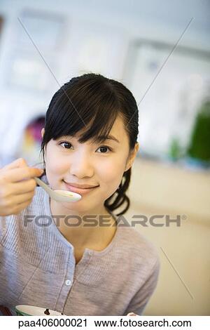 Young woman eating soup View Large Photo Image Stock Image - Young woman eating soup. Fotosearch