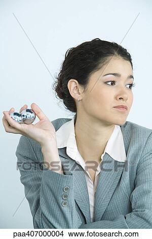 Businesswoman holding yin yang balls View Large Photo Image Picture - Businesswoman holding yin yang balls. Fotosearch