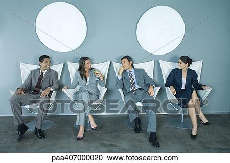 Four business executives sitting side by side View Large Photo Image Stock Image - Four business executives sitting side by side. Fotosearch
