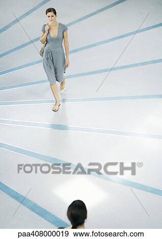 Woman walking, full length, high angle view View Large Photo Image Stock Photo - Woman walking, full length, high angle view. Fotosearch