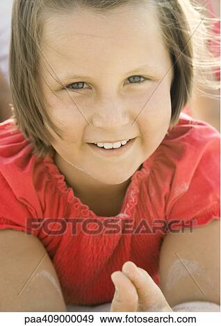Girl on beach, close-up portrait, smiling at camera View Large Photo Image Stock Photo - Girl on beach, close-up portrait, smiling at camera. Fotosearch