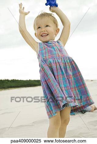 Little girl standing on beach View Large Photo Image Stock Photography - Little girl standing on beach. Fotosearch