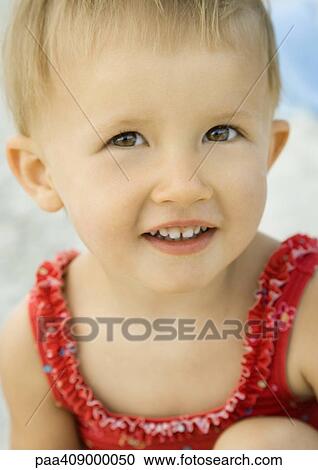 Toddler wearing bathing suit, close-up portrait View Large Photo Image Stock Image - Toddler wearing bathing suit, close-up portrait. Fotosearch