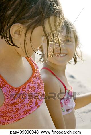Two girls on beach, close-up View Large Photo Image Stock Photo - Two girls on beach, close-up. Fotosearch