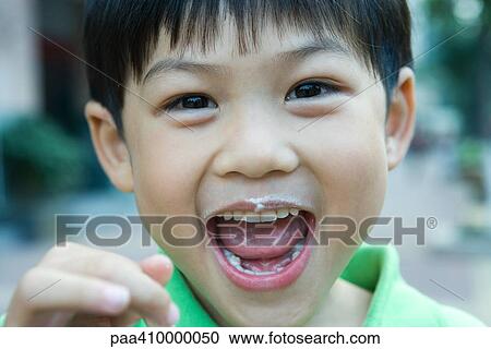Boy with mouth wide open and food stains around mouth, looking at camera View Large Photo Image Stock Image - Boy with mouth wide open and food stains around mouth, looking at camera. Fotosearch