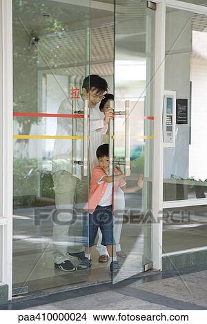 Family coming through door View Large Photo Image Picture - Family coming through door. Fotosearch