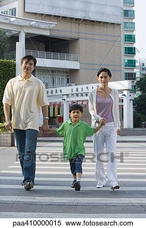 Family crossing crosswalk, holding hands View Large Photo Image Stock Photography - Family crossing crosswalk, holding hands. Fotosearch