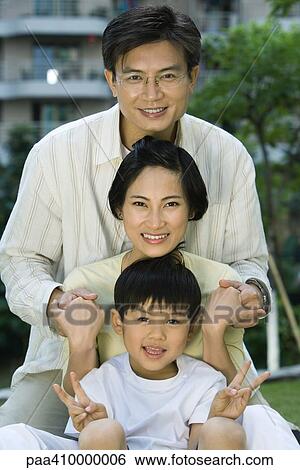 Stock Photograph - Man, woman and son, portrait. Fotosearch